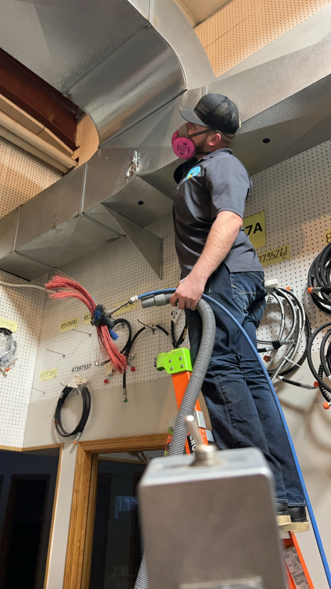 Ike's Duct Cleaning technician cleaning commercial ductwork